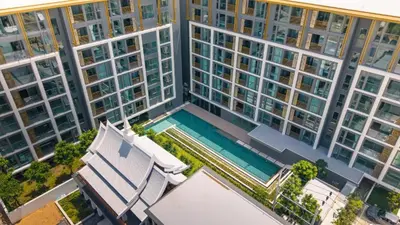 an overhead view of a large building with a swimming pool at Suite Melos 2BR Pool Gym Access Ozone in Laguna Phuket