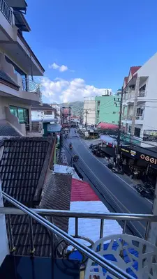 a view of a city street with a train on the road at Smile room 21 in Patong Beach