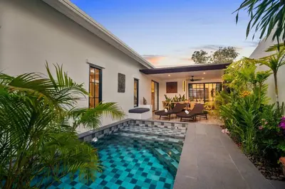 a swimming pool in the backyard of a house at Modern Zen Oasis in Phuket in Ban Saiyuan (1)