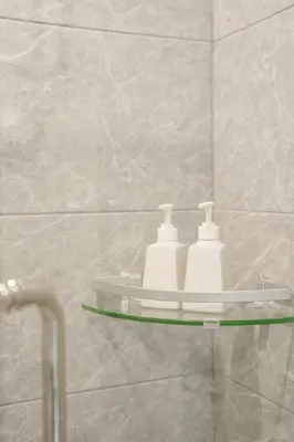 a bathroom with a shelf with two toothbrushes at B204 Banjong Studio 3 Minutes To Nai Harn Beach in Rawai Beach