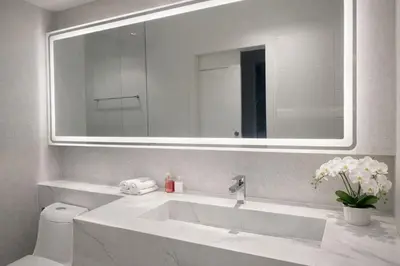 a white bathroom with a sink and a mirror at Zen Hilltop Nature Sanctuary Kamala Beach in Kamala Beach