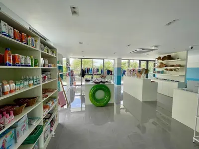 a store aisle with a green ball in the middle at Kora Beach 2Bdr 150 m to the Beach in Layan Beach