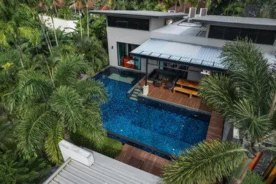 an aerial view of a house with a swimming pool at Aroha Villa with Private Pool Near Nai Harn Beach in Rawai Beach