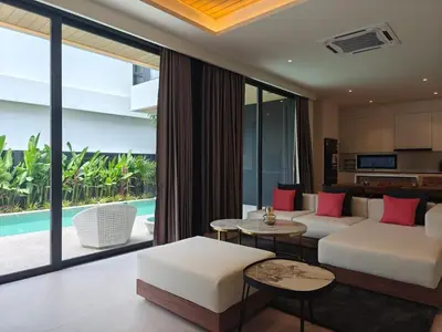a living room with a couch and a table at Aileen Layan Villa 3 Private Pool 4 Bedroom in Phuket Town