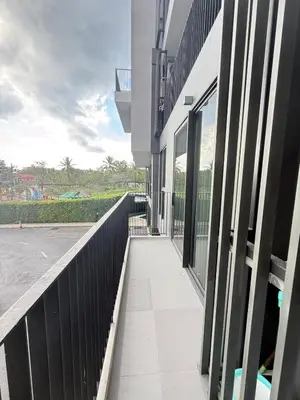 a balcony of a building with glass windows at Laguna SkyPark in Laguna Phuket