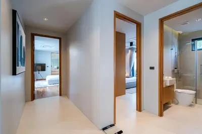 a bathroom with a toilet and a sink at Villa Kaya, 3BR contemporary pool villa in Phuket