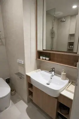 a bathroom with a sink and a toilet and a mirror at New 1BR Condo, walk to Bang Tao Beach in Laguna Phuket