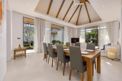 a dining room with a table and chairs at Modern 3BR Villa Kaimana with Private Pool in Ban Phru Champa