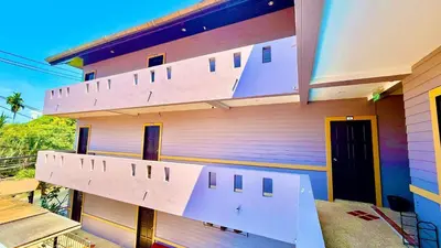 a building with three stairs on the side of it at For 3 Person in Central Pa Tong, Thailand in Patong Beach