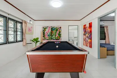 a pool table in the middle of a room at Villa Mayfair 4 bedrooms sea view with pool table in Ban Bang Chak