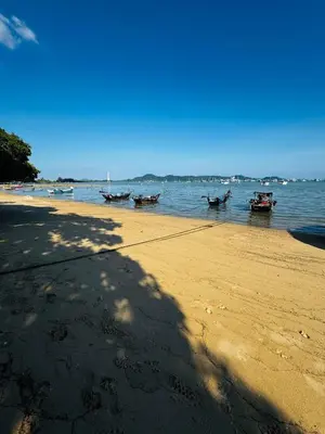 a group of boats in the water on a beach at Villa Mayfair 4 bedrooms sea view with pool table in Ban Bang Chak