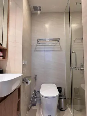 a bathroom with a toilet and a sink and a shower at SkyPark Laguna, 1 Bedroom Apartment in Phuket
