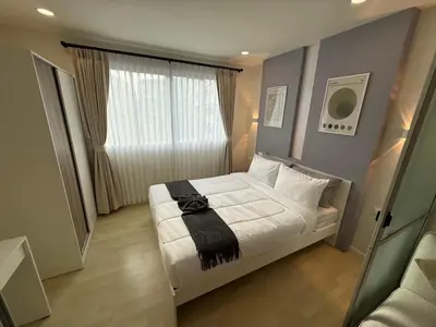 a small bedroom with a bed and a window at studio room dami in Kathu