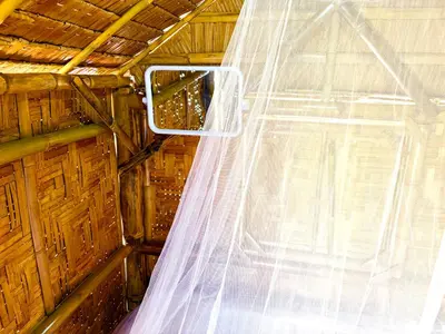 a wedding veil in a room with a window at Patong Canal House 3 in Patong Beach