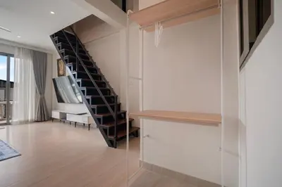 a staircase in a room with a glass wall at Patong Boutique in Patong Beach