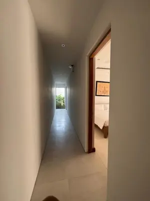 a hallway leading to a bedroom in a house at Anchan Grand Residence Bangtao in Ban Pak Lak
