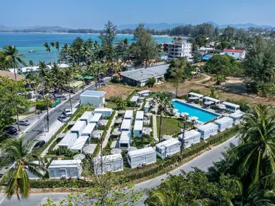 an aerial view of a resort with a pool at Apple House with Pool breakfast Surin Beach in Ban Lum Fuang