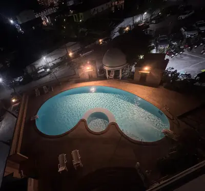 an overhead view of a swimming pool at night at Lahan 4 in Patong Beach