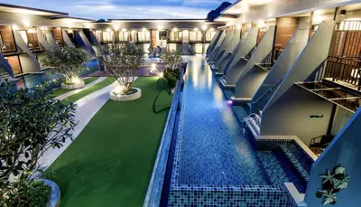 an overhead view of a pool in a building at The Phu Beach Hotel - SHA Plus in Ao Nang Beach