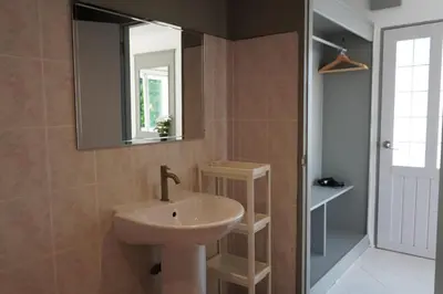 a bathroom with a sink and a mirror at Residy Hideaway in Patong Beach
