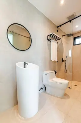 a bathroom with a toilet and a mirror at Sarah Place Private Tropical Villa in Ban Pak Lak