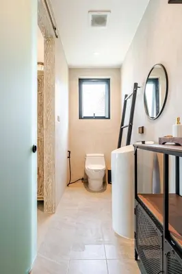 a bathroom with a toilet and a mirror at Sarah Place Private Tropical Villa in Ban Pak Lak