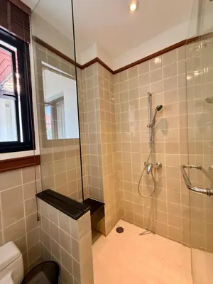 a bathroom with a shower and a toilet at Tropical Thai style 4 bedroom pool villa in Laguna Phuket