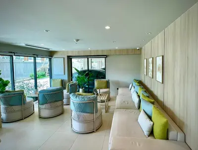 a living room with couches and chairs at Family Space Condo 2 Bdr BangTao in Ban Thalat Choeng Thale