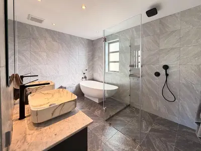 a bathroom with a tub and a sink and a shower at The Residence Resort Pool Villa 2 Bedrooms and 2 Bathrooms in Ban Thalat Choeng Thale