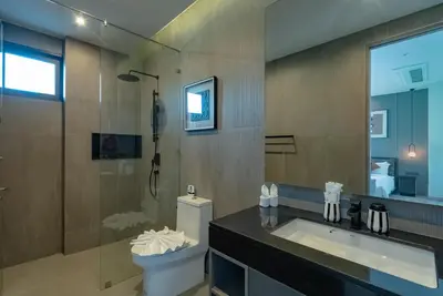 a bathroom with a toilet and a sink and a shower at Dara Villas - Rawai in Rawai Beach