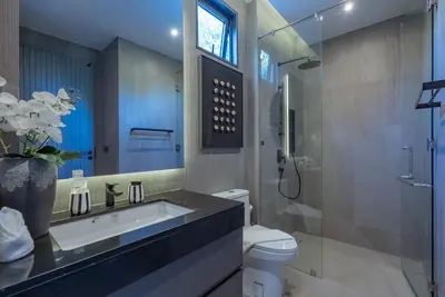 a bathroom with a sink and a toilet and a shower at Dara Villas - Rawai in Rawai Beach
