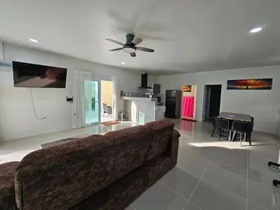 a living room with a couch and a table at Rawai 4 Bedrooms Private Pool Villa in Rawai Beach