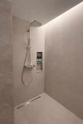 a shower with a shower head in a bathroom at Потрясающие апартаменты на Банг Тао in Laguna Phuket