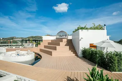 a house with a staircase and a swimming pool at New Boutique Studio, Near the Sea in Layan Beach