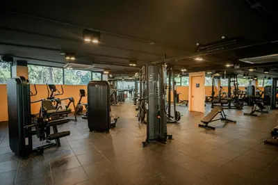 a gym with a lot of treadmills and machines at New Boutique Studio, Near the Sea in Layan Beach