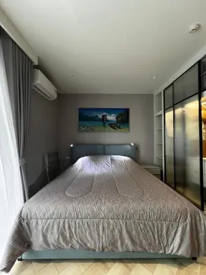 a bedroom with a bed and a window at Title Legendary suite pool view E301 in Phuket