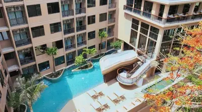 an aerial view of a swimming pool in a building at The Proud Karon Phuket - New 1BR Apartment 6floor in Karon Beach