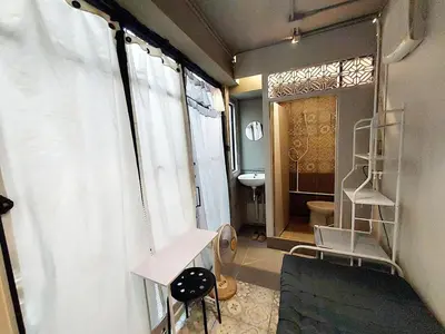 a bathroom with a shower curtain and a sink at FanRoomGroundFlNonehotshower in Ban Ket Ho