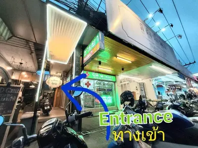 a store with motorcycles parked in front of it at FanRoomGroundFlNonehotshower in Ban Ket Ho