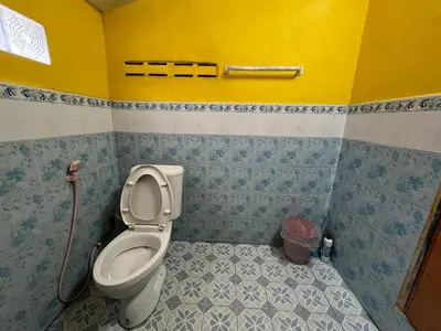 a bathroom with a toilet with a hose at Ja Mia's Bungalow at Pasai Beach in Ko Yao Noi
