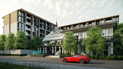 a red car parked in front of a building at Suite Salina 2BR Pool Gym Access Ozone in Laguna Phuket