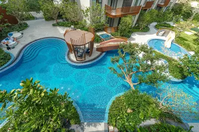 an aerial view of a swimming pool in a resort at Condo Close to the Beach and City Center in Laguna Phuket
