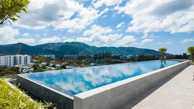 a large swimming pool on the roof of a building at Apartment 2 bedrooms in SkyPark in Laguna Phuket
