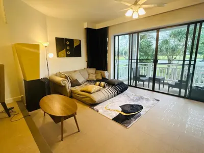 a living room with a couch and a table at Allamanda 2 Laguna Phuket luxuries 1 bedroom in Laguna Phuket