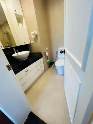 a bathroom with a white sink and a toilet at Allamanda 2 Laguna Phuket luxuries 1 bedroom in Laguna Phuket