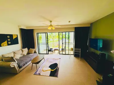a living room with a couch and a table at Allamanda 2 Laguna Phuket luxuries 1 bedroom in Laguna Phuket