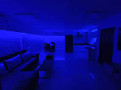 a blue room with a couch and a dining room at Seaview paradise in Patong Beach