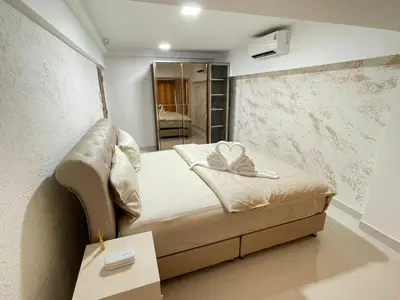 a small bedroom with a bed and a mirror at Seaview paradise in Patong Beach