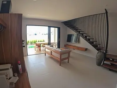 a living room with a staircase and a dining room at Rawai 2 Bedrooms Private Pool Villa in Ban Saiyuan (1)