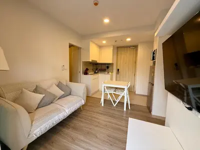 a living room with a couch and a table at Laguna cozy 2 bedroom apartment 5min to the beach in Laguna Phuket
